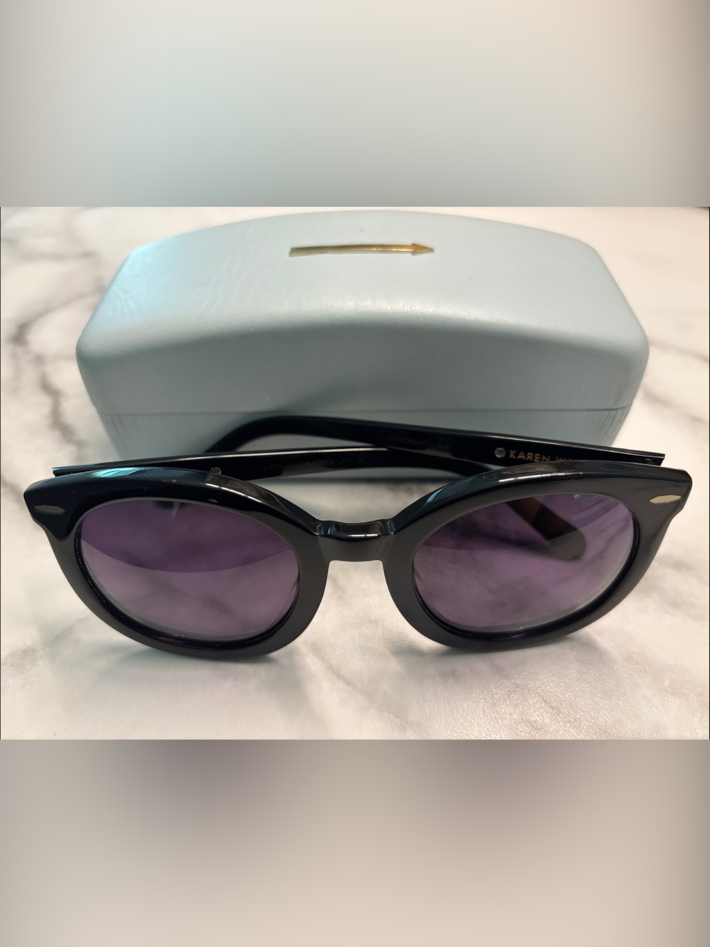 Karen Walker Black Frame Sunglasses with Purple Lenses